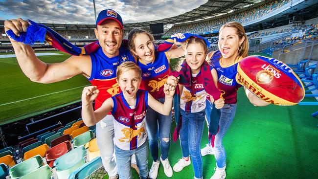 Lions fans Chris and Yvette La Burniy with their children Henry, 8, Eva, 13, and Ruby, 11, would love to see the AFL Grand Final played at the Gabba in Queensland. Picture: Nigel Hallett