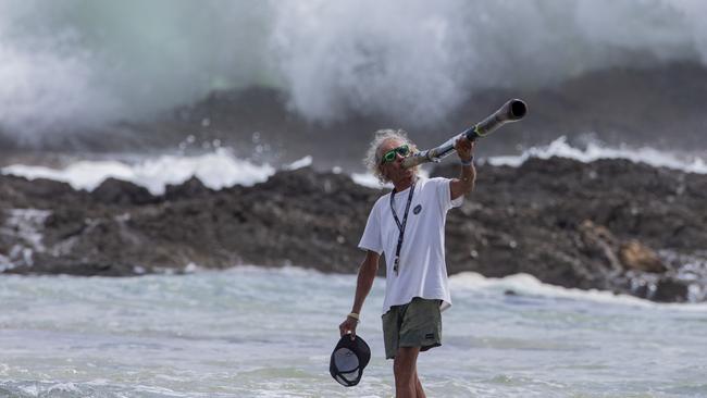 Snapper Rocks local Aboriginal identity Russell Corowa blessing the ocean on Sunday 2 January 2022. Picture: Jerad Williams