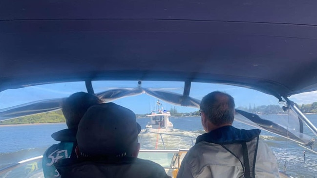 A Bayliner is towed back to Yamba Marina by Yamba Marine Rescue. The boat owners have praised the swift action of the rescue service after they ran into engine trouble 8km off Yamba.