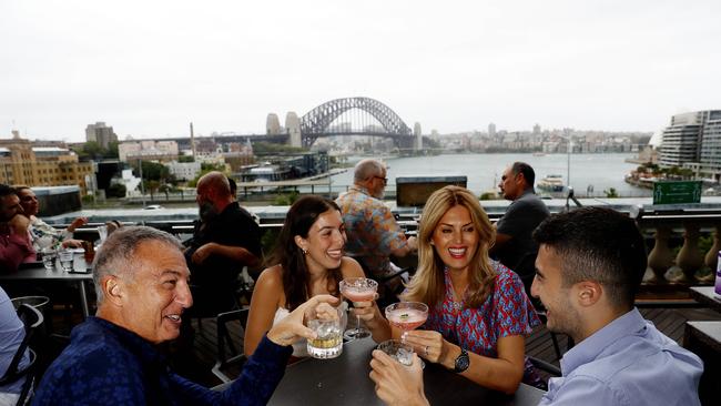 Cafe Sydney patrons, from left, Derek, Jemma, Christina and Jae Glover take in the prized view of Sydney Harbour Bridge on Monday. Picture: Nikki Short