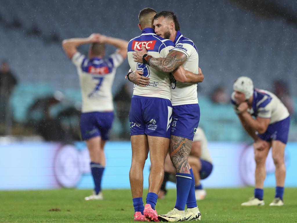 Jacob Kiraz and Bronson Xerri share an embrace of relief at full-time. Picture: Cameron Spencer/Getty Images