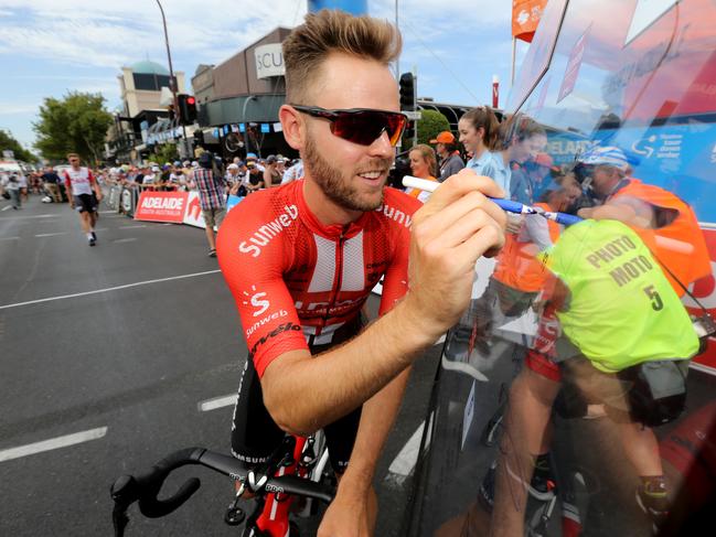 Chris Hamilton signs in at the start of stage 1 of the Tour Down Under in Adelaide, Tuesday, January 15, 2019. (AAP Image/Kelly Barnes) NO ARCHIVING, EDITORIAL USE ONLY