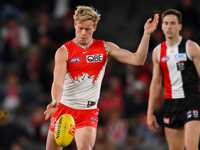 MELBOURNE, AUSTRALIA – JULY 07: Isaac Heeney of the Swans kicks the ball during the round 17 AFL match between St Kilda Saints and Sydney Swans at Marvel Stadium, on July 07, 2024, in Melbourne, Australia. (Photo by Morgan Hancock/AFL Photos/via Getty Images)