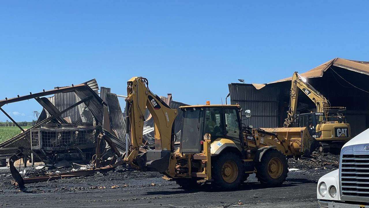 Crews begin the cleanup operation the morning after the fire.