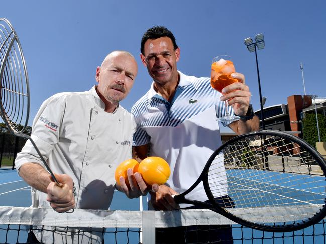 Chef Simon Bryant with tennis identity Roger Rasheed holding oranges, Aeporol Spritz and racquets at Next Generation, Memorial Drive, Adelaide on Wednesday 18 December, 2019. (AAP Image/Sam Wundke)