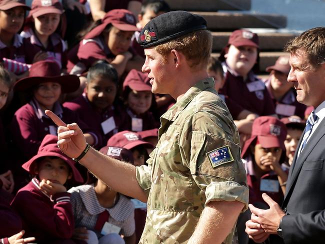 Prince Harry and Premier of New South Wales Mike Baird (R) meets schoolchildren at the Sydney Opera House. Picture: Mark Metcalfe