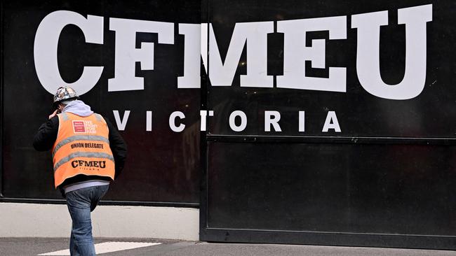 A union official walks past the Victorian headquarters of the CFMEU in Melbourne. Picture: William West/AFP