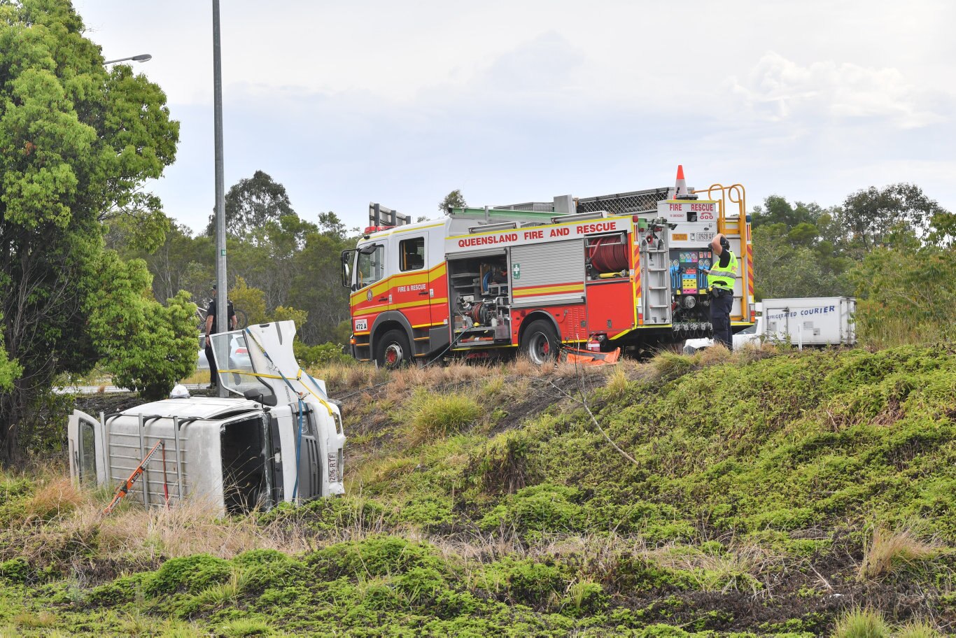 A 70 year old female was trapped inside their vehicle after it rolled on the Coolum-Yandina Road near the Coolum roundabout on the Sunshine Motorway. Photo: John McCutcheon / Sunshine Coast Daily