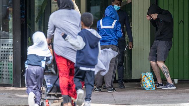 Children walk past intoxicated people.  Richmond supervised injecting room on Lennox street.