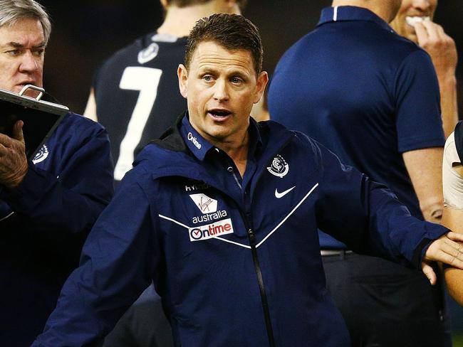 MELBOURNE, AUSTRALIA - JULY 22:  Blues head coach Brendon Bolton walks from his huddle during the round 18 AFL match between the Carlton Blues and the Hawthorn Hawks at Etihad Stadium on July 22, 2018 in Melbourne, Australia.  (Photo by Michael Dodge/Getty Images)