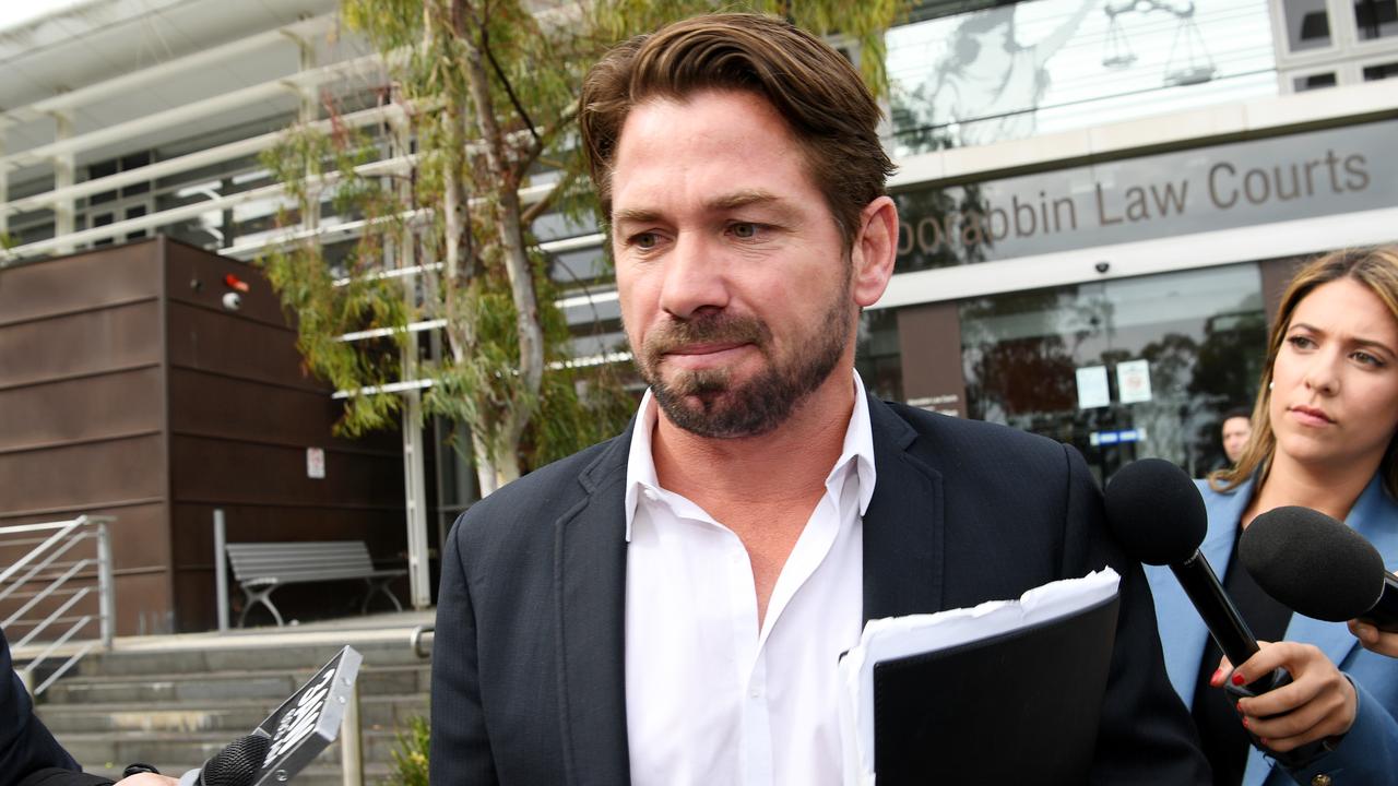 Former North Melbourne premiership player Shannon Grant leaves Moorabbin Magistrates Court.