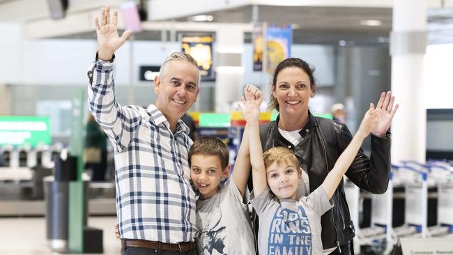 Angela Clive returns home to Brisbane after two weeks mandatory hotel quarantine in Melbourne. She was in Mongolia for work. She was met by her husband Andrew and her sons James, 9, and Henry, 6. Picture: News Corp/Attila Csaszar