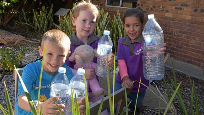 RAISING MONEY: Heath Heinemann, Aubree Davis and Savannah Daly help to recycle at Goodstart Early Learning, by donating bottles to the Container Exchange. Picture: Jorja McDonnell