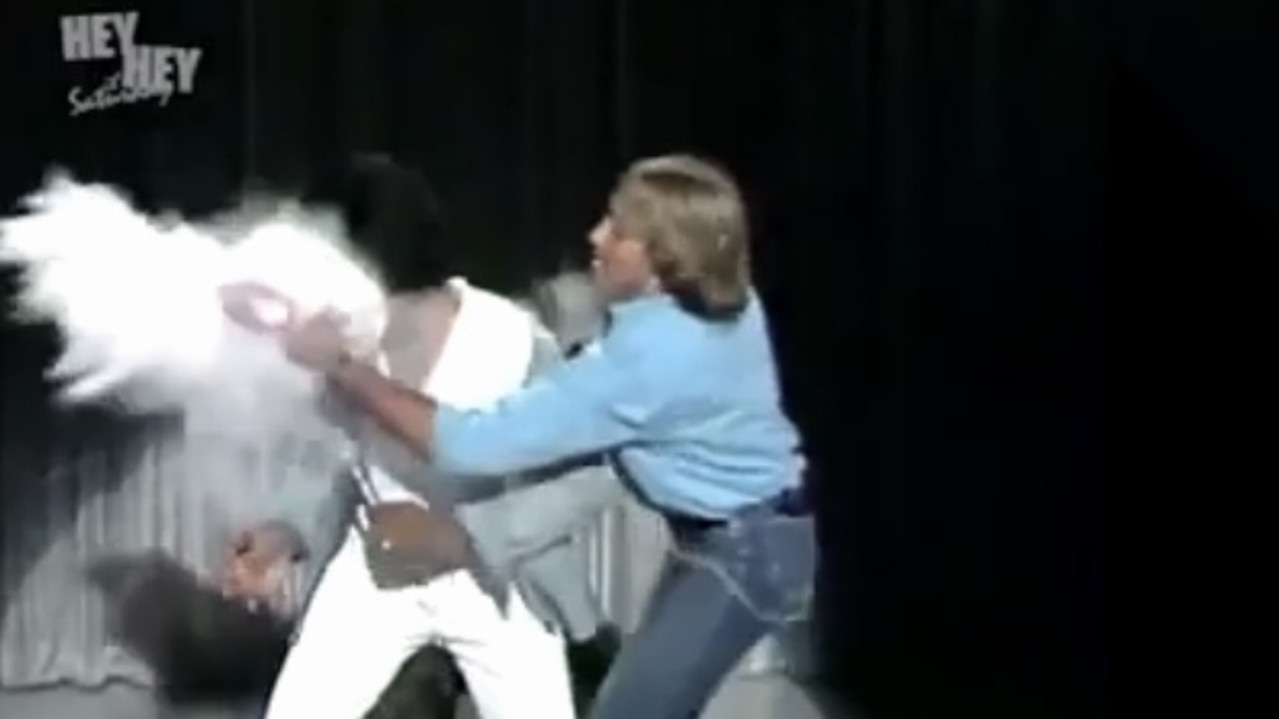 Kamahl having white powder shoved on his face on Hey Hey.