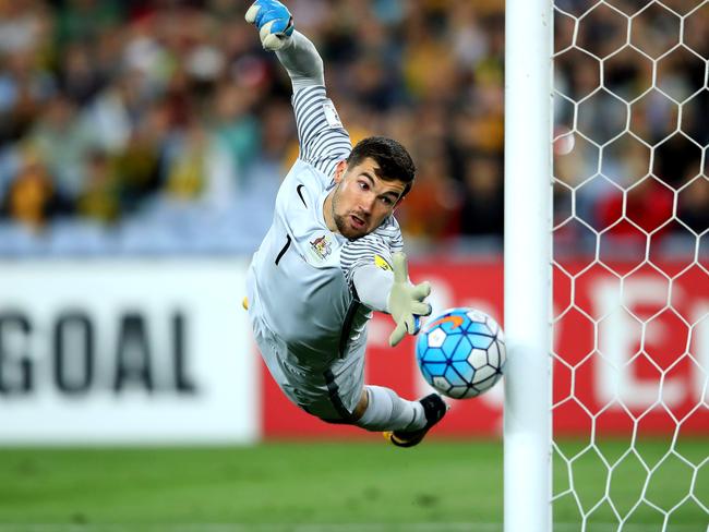 SYDNEY, AUSTRALIA - OCTOBER 10: Mathew Ryan of Australia saves a goal during the 2018 FIFA World Cup Asian Playoff match between the Australian Socceroos and Syria at ANZ Stadium on October 10, 2017 in Sydney, Australia.  (Photo by Cameron Spencer/Getty Images) ***BESTPIX***