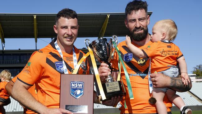 Player of the match Cameron Williams with skipper Christian Nahlous and his son Coah. Picture: John Appleyard