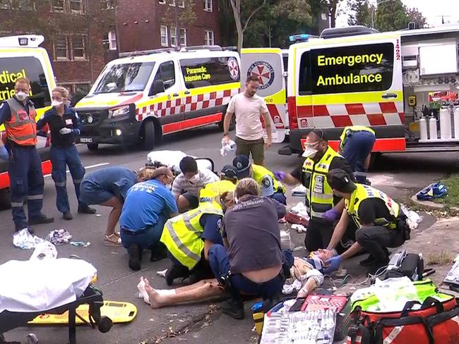 Fees Apply. Two pedestrians run over and dragged by reversing car in Double Bay, NSW. Must Credit: OnScene Bondi