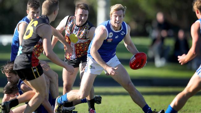 St Peter's Old Collegians’ Tom Fotheringham gets away with the ball. Picture: Dean Martin