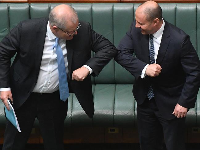 ***BESTPIX*** CANBERRA, AUSTRALIA - APRIL 08: Prime Minister Scott Morrison (L) react with Treasurer Josh Frydenberg after the Coronavirus Economic Response Bill was presented in the House of Representatives on April 08, 2020 in Canberra, Australia. The governments $130bn AUD Coronavirus Economic Response Bill will be put to parliament today with about 40 lower-house MPs expectedÂ­ attendÂ­ for the extraordinary COVID-19 sitting. After discussions between Prime Minister Scott Morrison and Opposition Leader Anthony AlbanesÂ­e a decision was made to recall parliament for the wage subsidy package to be considered by the limited number of MPs and senators. (Photo by Sam Mooy/Getty Images)