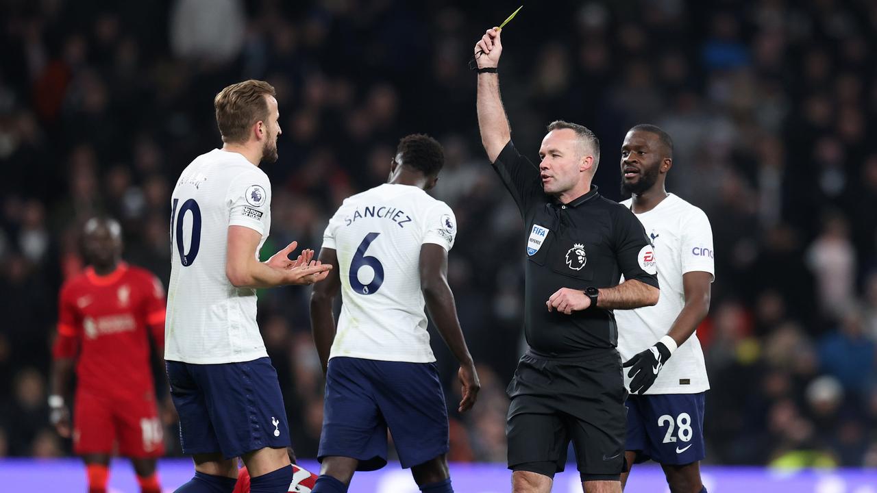 Paul Tierney shows Harry Kane of Tottenham Hotspur a yellow card. (Photo by Alex Pantling/Getty Images )