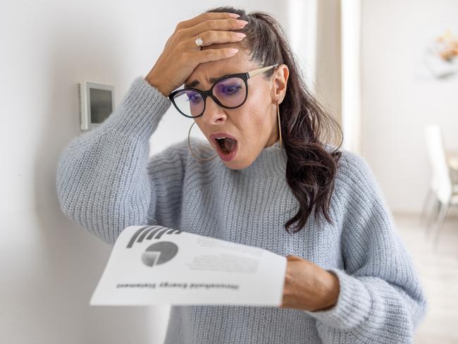 Woman is shocked from the rising energy costs and the bill she received for heat and electricity for her household.. Bill shock generic