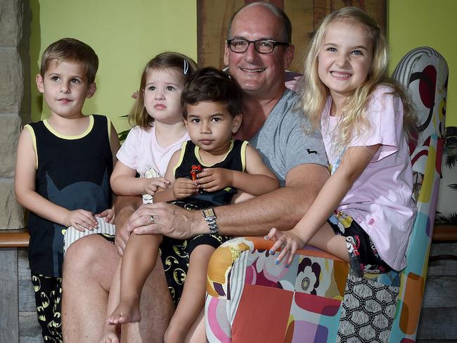 David Koch, with some of his grandchildren, says pay pocket money monthly rather than weekly.