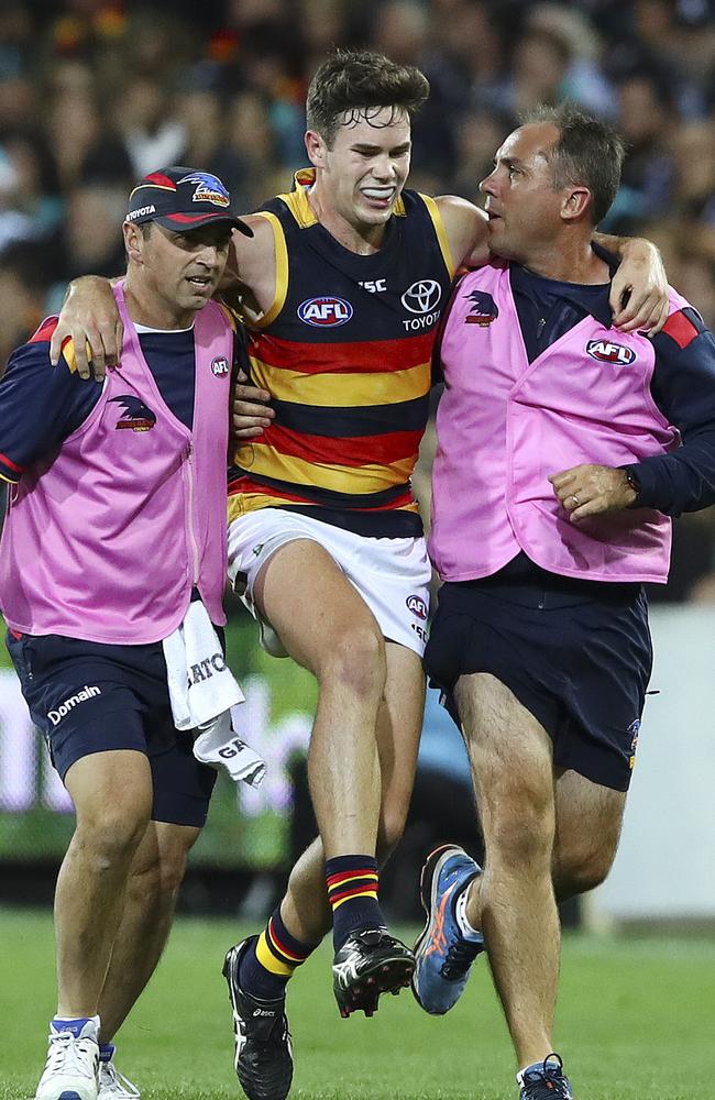 Adelaide’s Mitch McGovern is taken from the ground with a hamstring injury. Picture: Sarah Reed