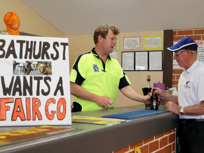 Brad Ashton has worked behind the bar for ten years at the Bathurst Greyhound Club. The community is optomisitc for the future now Baird is set to oveturn the racing ban. Picture: Jonathan Ng