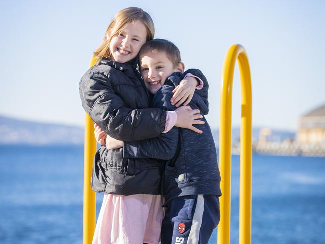 Chanel, 8, and Harlan Cetaj, 5, of Latrobe, enjoy a cold but sunny morning on the Hobart waterfront. Picture: Richard Jupe