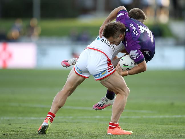 Euan Aitken catches Ryan Papenhuyzen with a solid tackle. Picture: Mark Kolbe/Getty Images