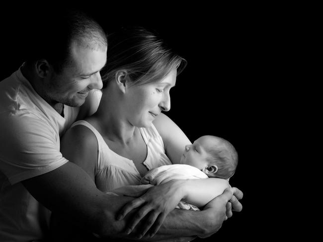 Tasmanian parents Marcus and Karin with their baby boy who was born via surrogacy. Picture: Contributed