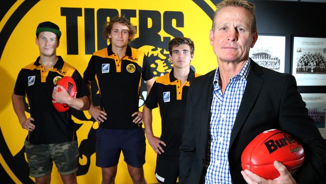 Glenelg Football Club players LtoR: Christian Howard 24, Ben Edwards 20 and Jake Johansen 19 with Nick Chigwidden (President) at Glenelg Oval. Glenelg Football Club's financial situation is pretty dire and they are calling on supporters to get behind the club this year. 19/02/16 Picture: Stephen Laffer