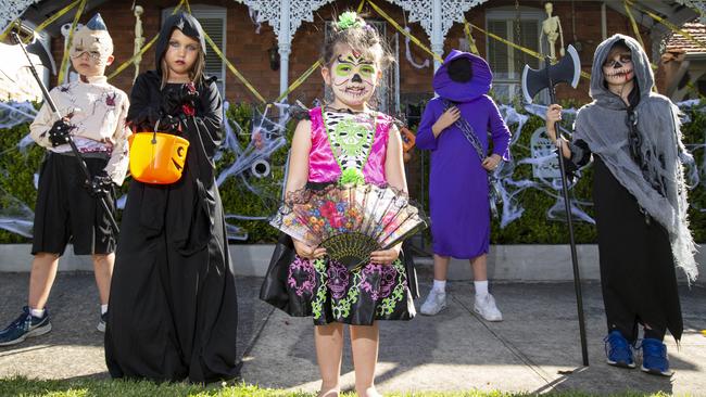 Harvey, 8, and Mischa, 8, and Ella, 3, Samuel, 10, and Joshua, 7, prepare for trick-or-treating. Picture: Justin Lloyd