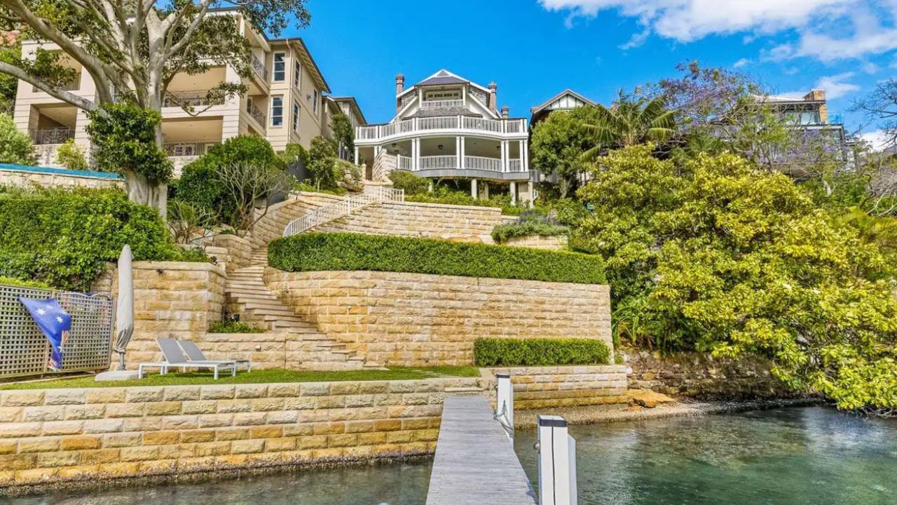 The six-bedroom mansion fronts Mosman Bay.
