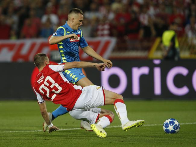 Napoli midfielder Piotr Zielinski challenges for the ball with Red Star's Milan Rodic. Picture: AP