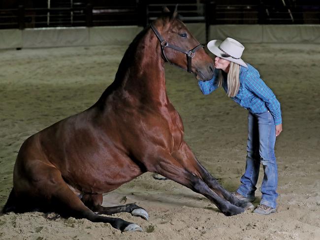 Horse whisperer Heidi Mackay with Brigalow. Pic by Luke Marsden.