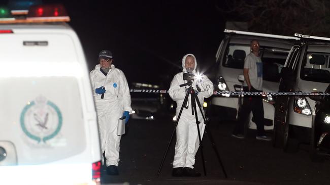 Police swamped the scene on Hull Road at West Pennant Hills last night. Picture: David Swift.