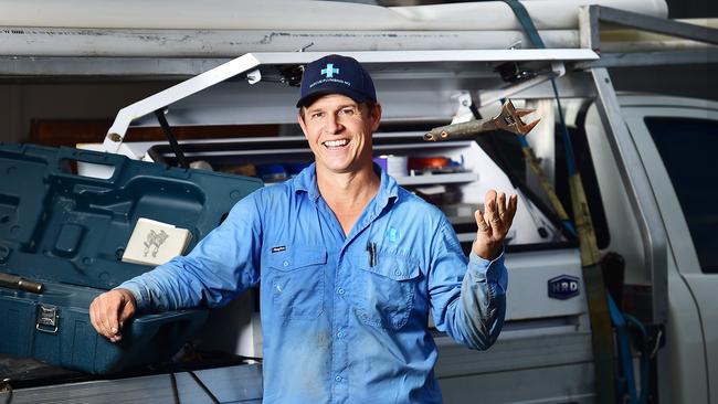 Brad Wilton, owner Rescue Plumbing NQ, is happy to be back working after a horror cycling crash. Picture: Shae Beplate.