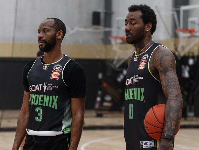 Former No.1 NBA Draft Pick and South East Melbourne co-owner John Wall (11) with Phoenix import Will Cummings. Picture: Kadek Thatcher/Phoenix Media