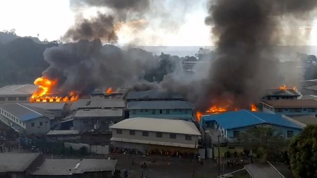 Parts of the Chinatown district on fire in Honiara on Solomon Islands as rioters torched buildings in the capital in a second day of anti-government protests. Picture: AFP