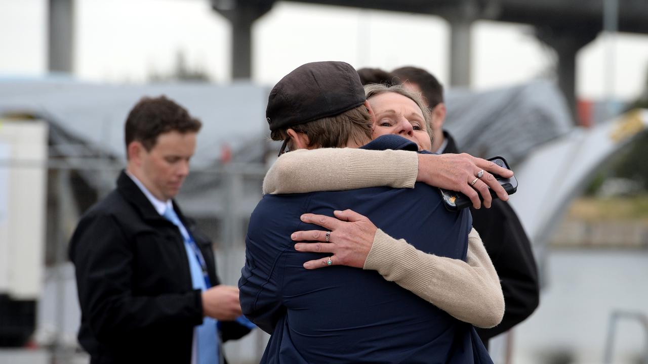 Owners and staff gather at ATET floating nightclub at North Wharf after the venue was damaged by an overnight fire. Picture: NCA NewsWire / Andrew Henshaw