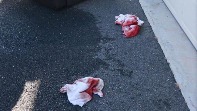 Bloodied towels at the scene in Littlehampton. Picture: AAP / Brenton Edwards