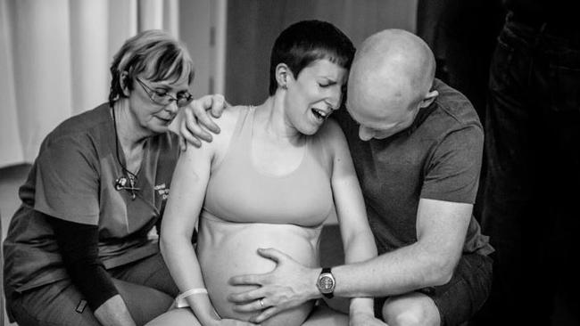 Cheryl Sheriffs from Ideal Birth Doula (left) coaching Marielle through her pains as partner John supports her during labour, 2014. Photo: Selena Rollason, Brisbane Birth Photography