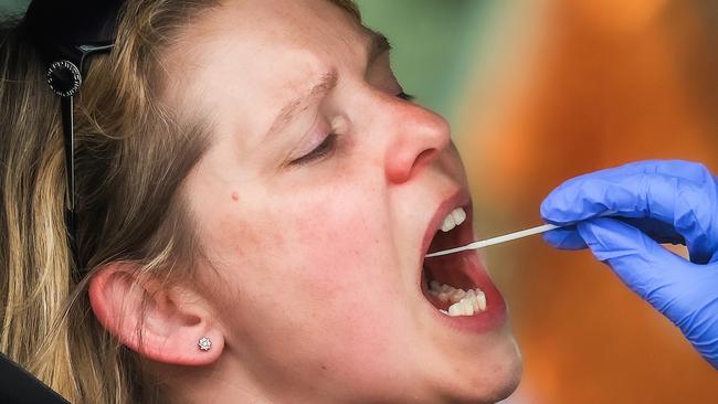 A woman has a Covid-19 test at an Albert Park testing site in Melbourne. ResApp aims to test for the virus using a cough. Picture: Ian Currie