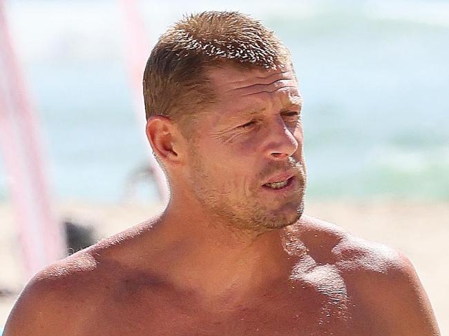 GOLD COAST, AUSTRALIA - NewsWire Photos APRIL 6, 2024: Hundreds of people turned out at the Greenmount Beach Surf Club on the Gold Coast to celebrate the life of Ed Fanning. His brother Mick led a surf out after the service. Picture: NCA NewsWire/Tertius Pickard