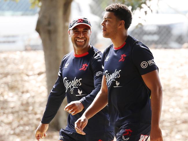 Michael Jennings (wearing cap, left) walks to training on Wednesday. Picture: Rohan Kelly