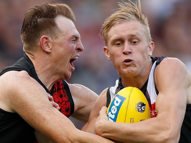 MELBOURNE, AUSTRALIA - APRIL 25: Jaidyn Stephenson of the Magpies is tackled by Brendon Goddard of the Bombers during the 2018 AFL round five ANZAC Day match between the Collingwood Magpies and the Essendon Bombers at the Melbourne Cricket Ground on April 25, 2018 in Melbourne, Australia. (Photo by Adam Trafford/AFL Media/Getty Images)