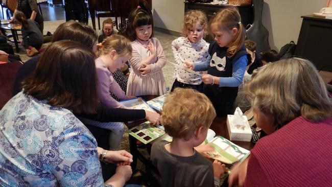 Children of KU Fox Valley sharing time with their older friends