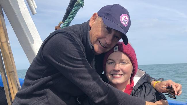 Scott Miers and daughter Emily Miers after Emily completed the 11-hour swim.