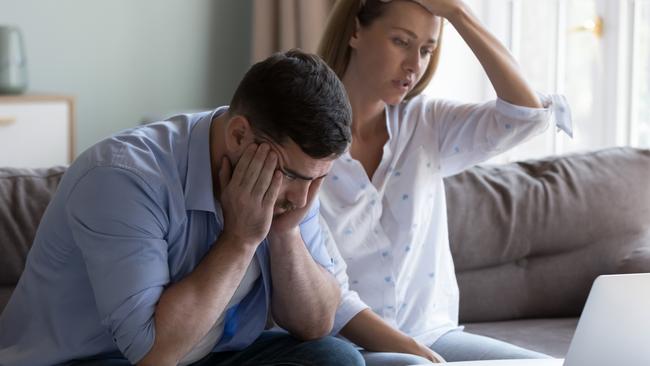 Stressed spouses manage family finances, analyze expenses, check savings and budget, looks disappointed due to mortgage arrears, unpaid utility bills, debt notice. Lack of money, high utility concept